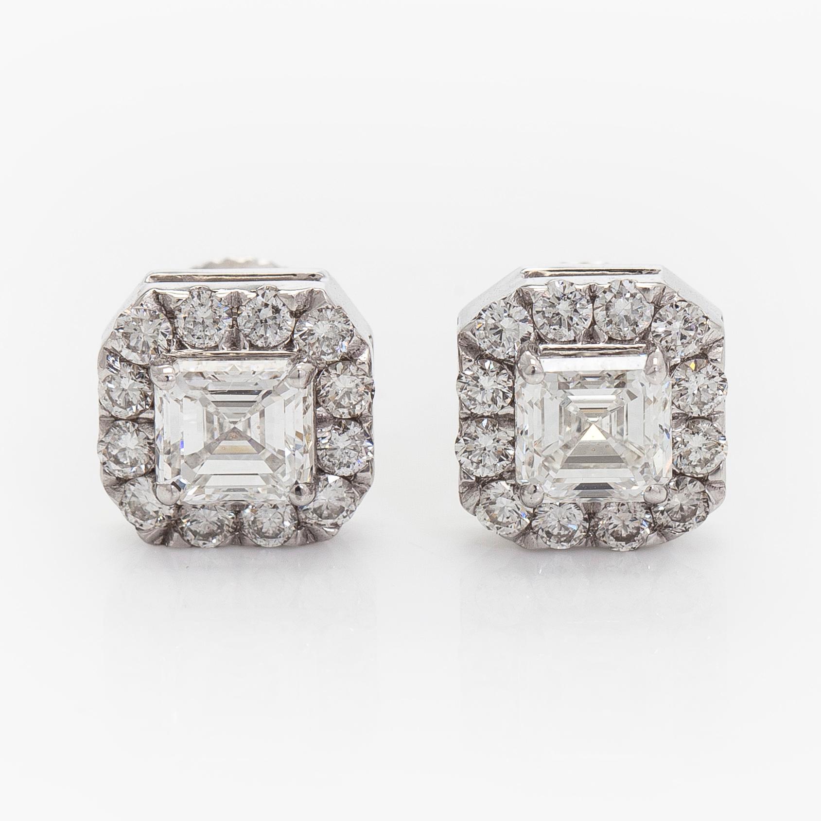 Earrings, emerald cut diamonds 0.70 ct / each and brilliant cut diamonds, 18K white gold.