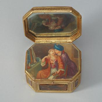 A gilt-brass, stone and glass box with double-folded lid with erotic scene. Louis XVI.