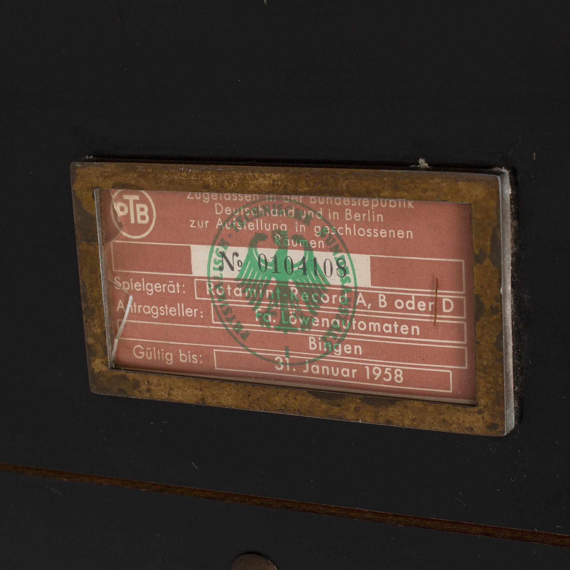 a mid 20th century Rotamint Record gambling machine.