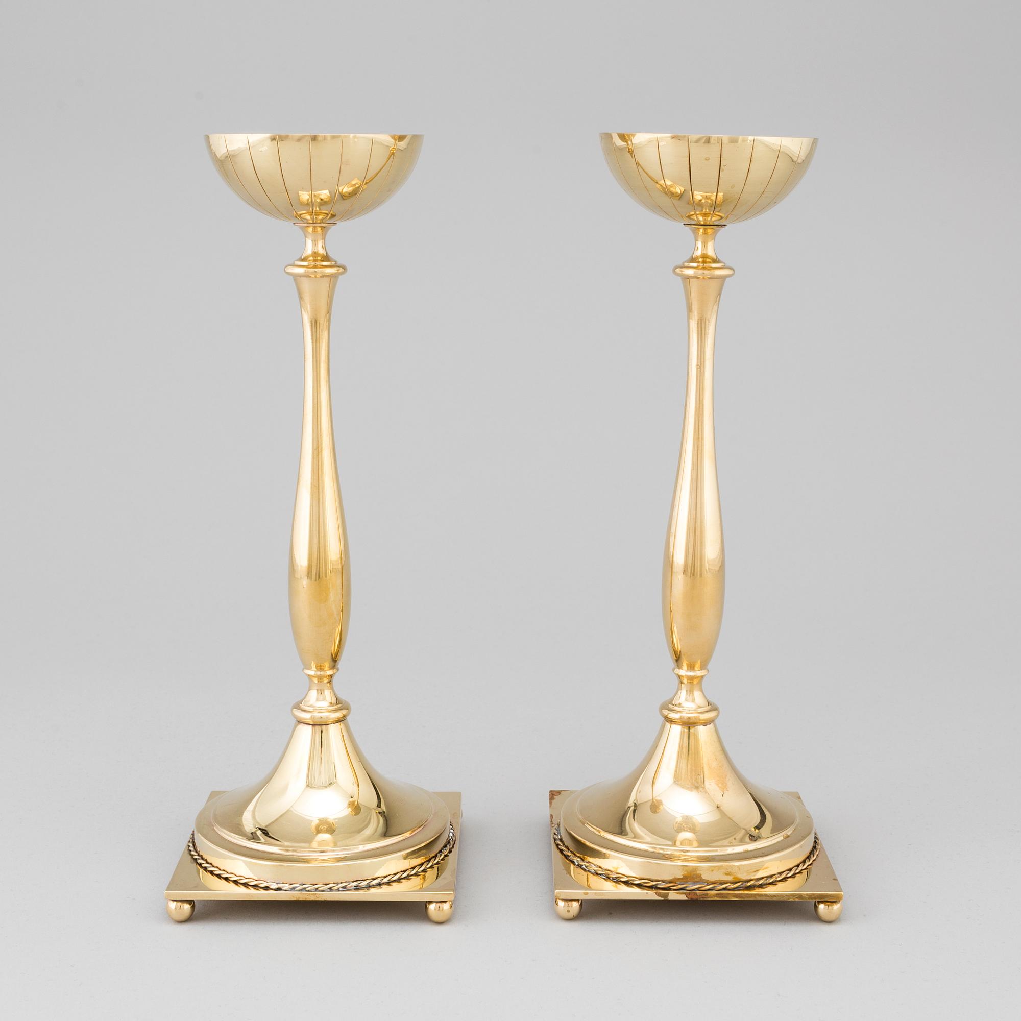 A pair of mid 20th century brass candlesticks by Gunnar Ander for Ystad Metall.
