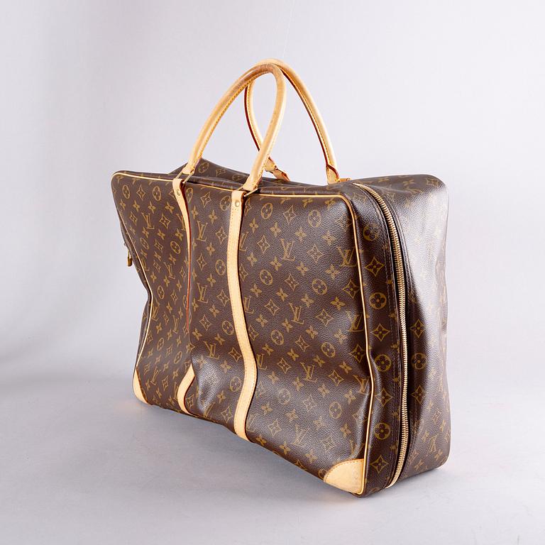 A Louis Vuitton travel bag.