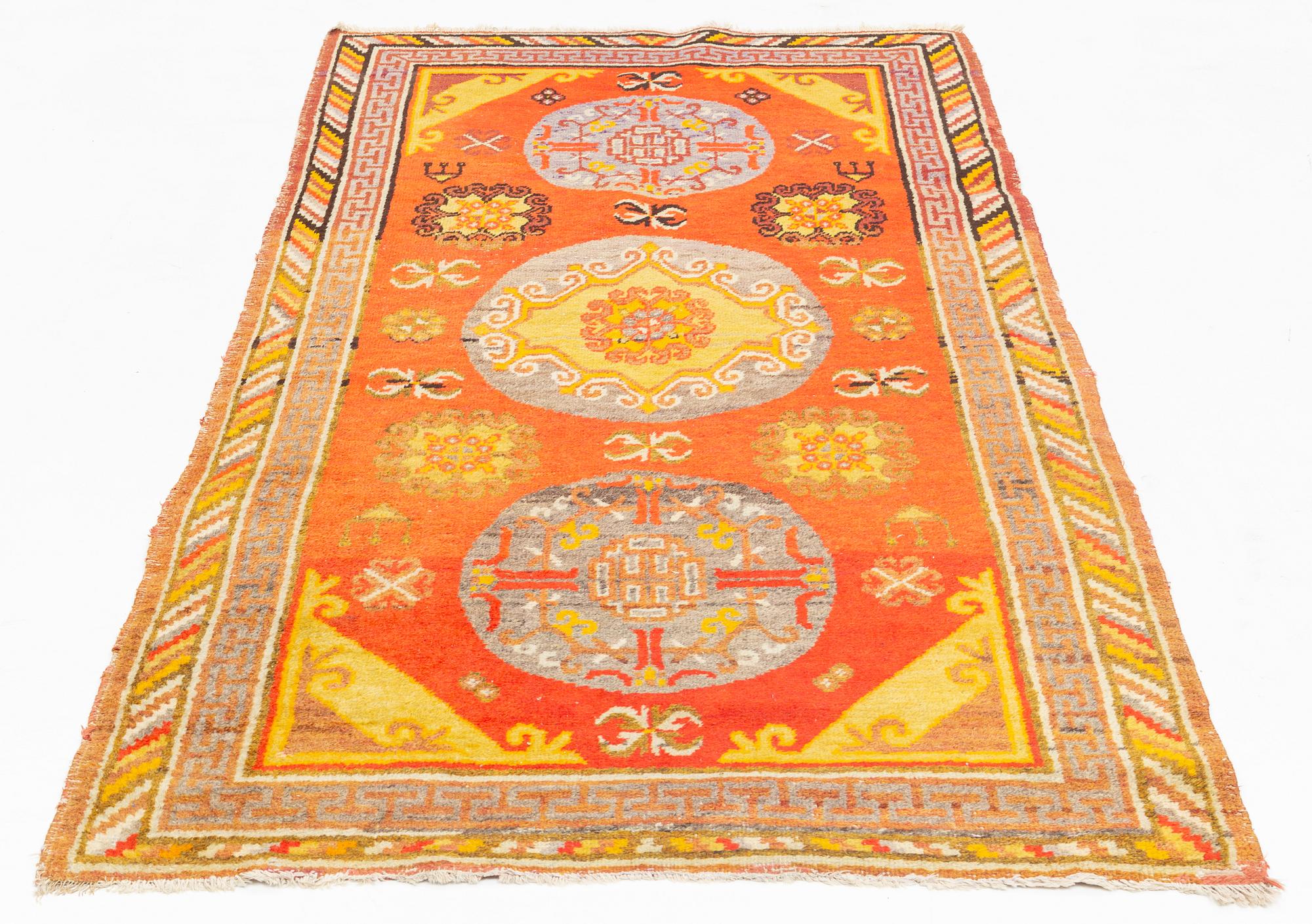 A Carpet, Khotan (?), 217 x 108 cm.