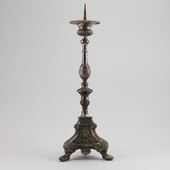 An 18th century bronze candlestick.