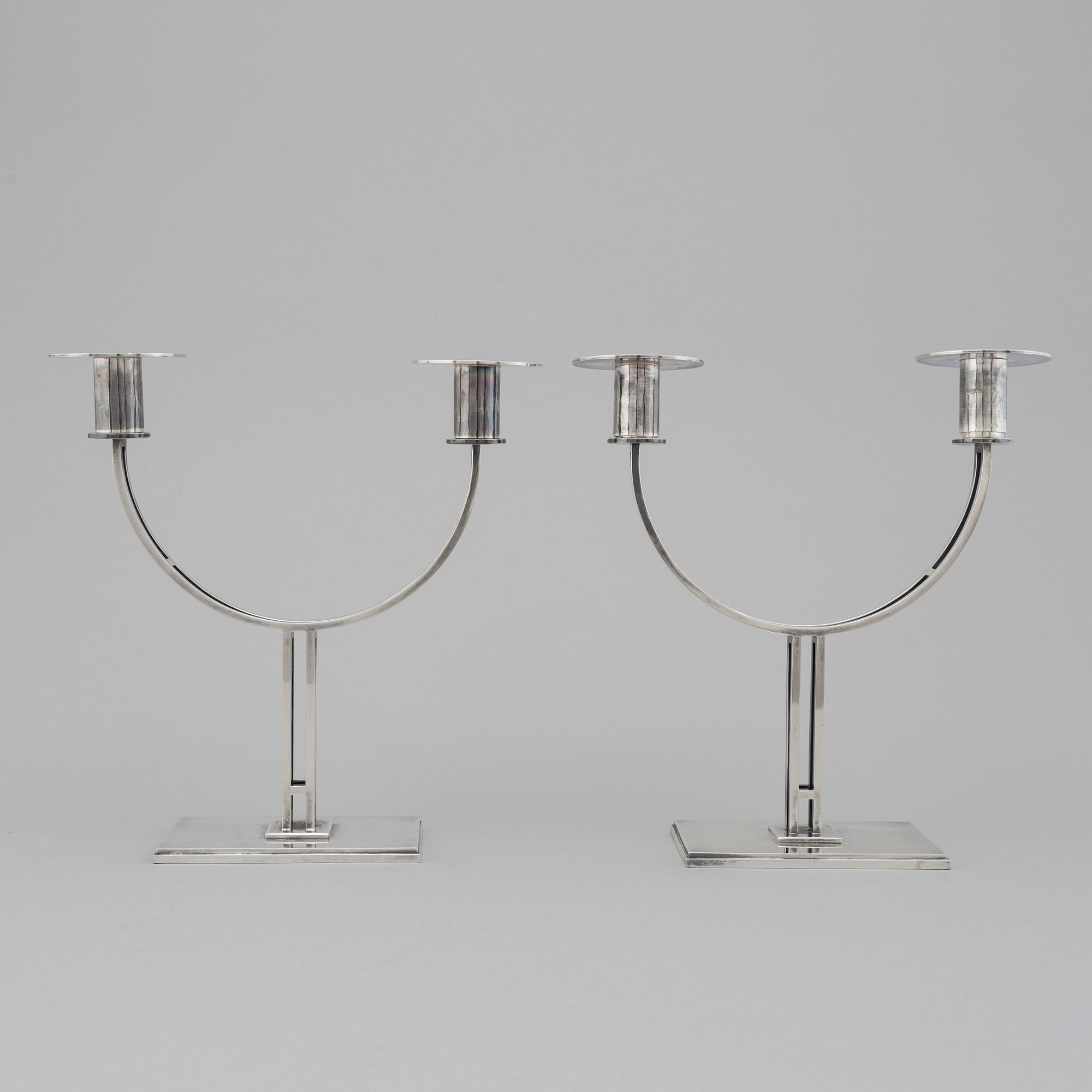 A pair of Klas-Göran Tinbäck two light sterling silver candelabra. Stockholm, 1989.