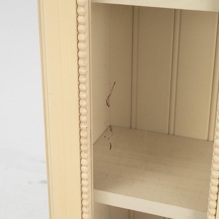 A pair of Gustavian style book cabinets, 21st century.