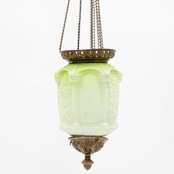 An art noveau glass and brass ceiling lamp from around the year 1900.