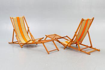 Sun loungers, a pair of footstools, 1950s.