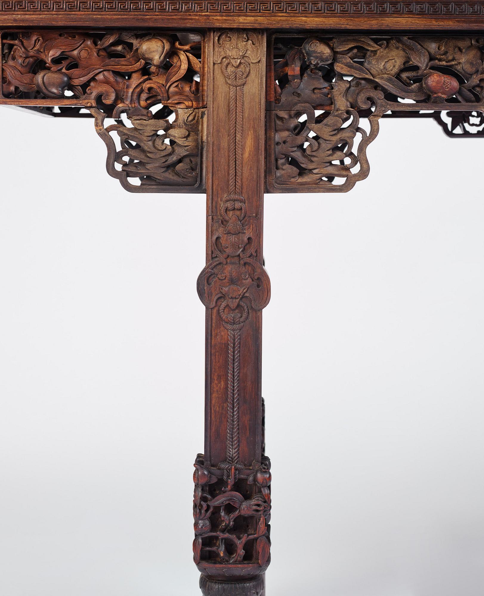 A massive zitan recessed-leg long table 'Jiaotousun Qiotouan', Qing dynasty, 19th century.