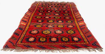 An antique Central Asian carpet, possibly Kirghiz, c. 346 x 154 cm.