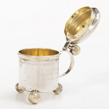 Sugar tongs, cream jug and miniature decanter, silver, including CG Hallberg, Stockholm 1955.