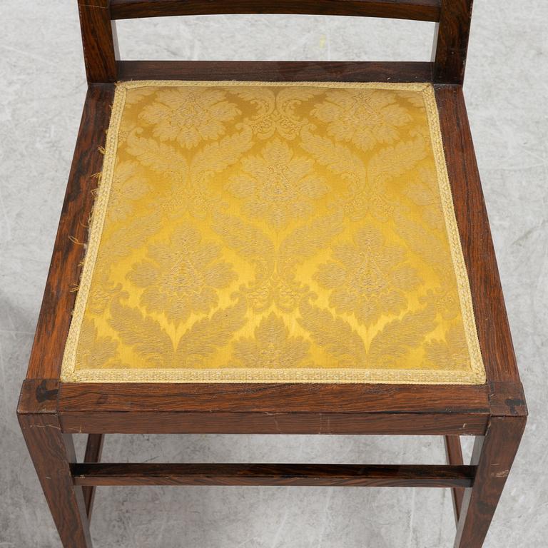 A group of five rosewood veneered chairs and a stool, mid 20th Century.