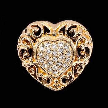 1434. A heart-shaped golden brooch by Christian Dior.