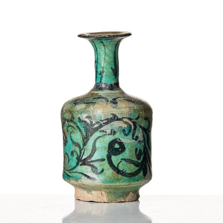 A Kashan turquoise blue-glazed ewer, central Persia (Iran), 11th to 12th century.