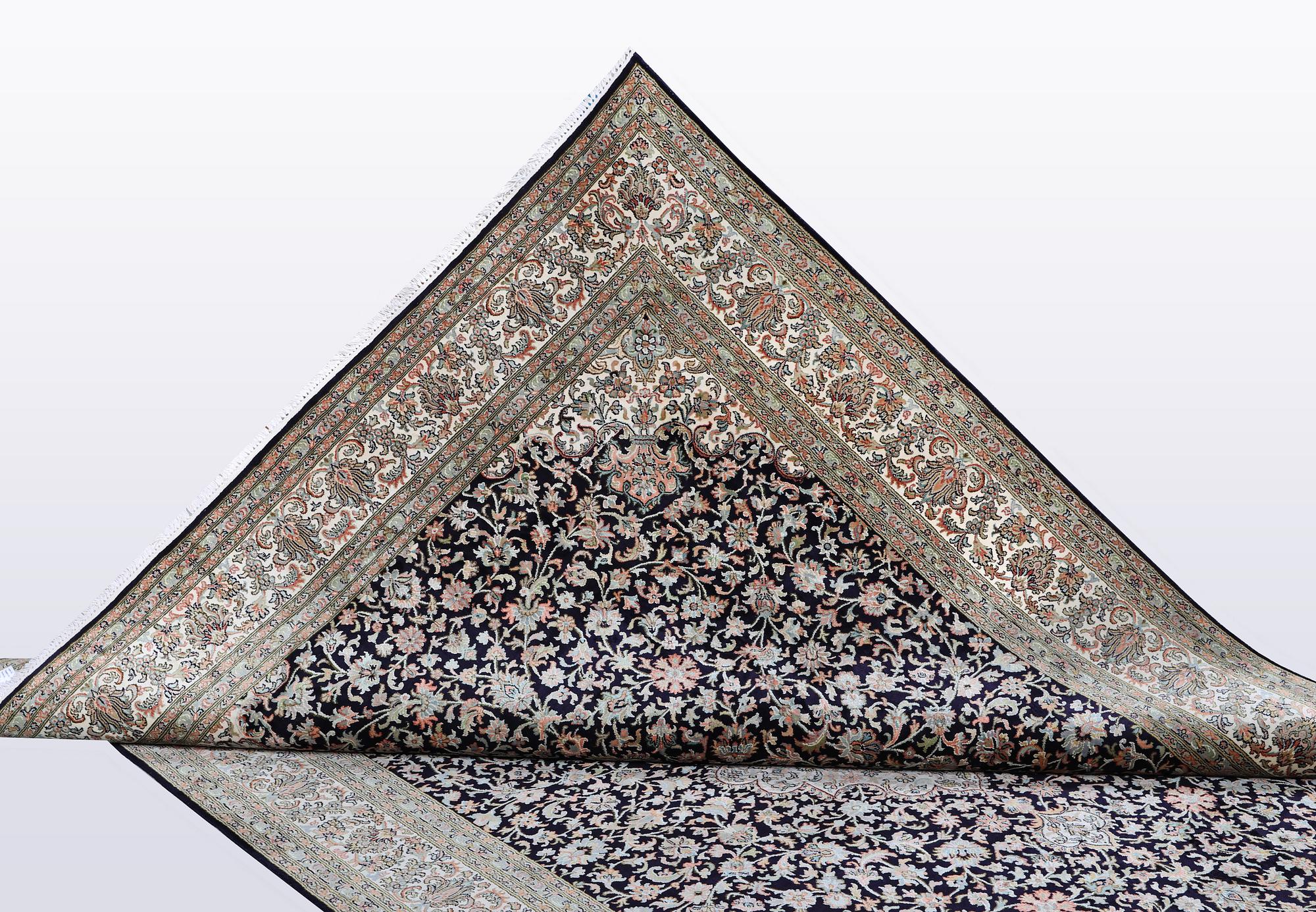 A carpet, silk Kashmir, ca 279 x 195 cm.