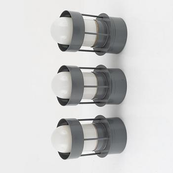 Three ceiling or wall lights from Louis Poulsen.