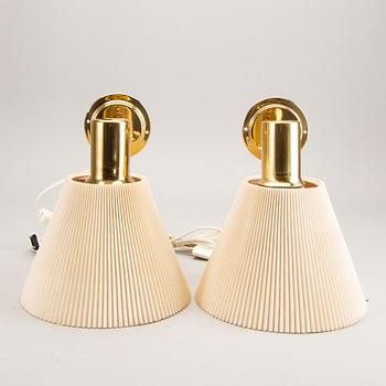 A pair of IKEA 1990s Stockholm brass wall lamps.