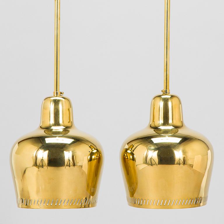 Paavo Tynell, a pair of mid 20th century ceiling lights, model 1699, for Taito / Idman.
