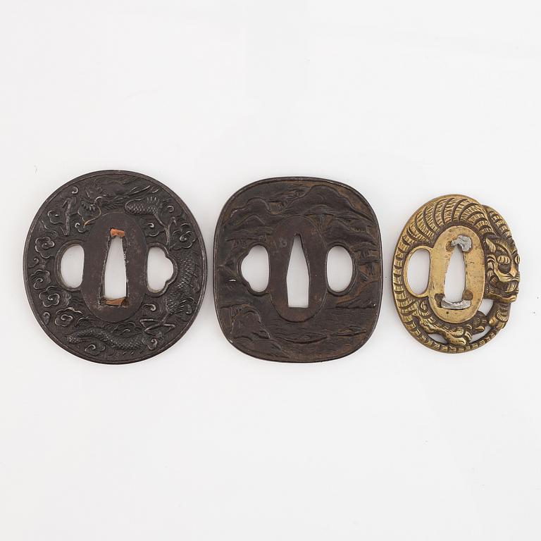 Five tsubas, iron and brass, Edo/Meiji period.
