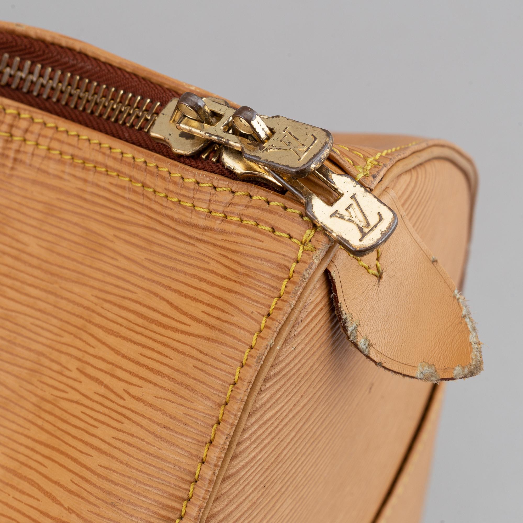 Louis Vuitton, am Epi 'Keepall 50' weekend bag.