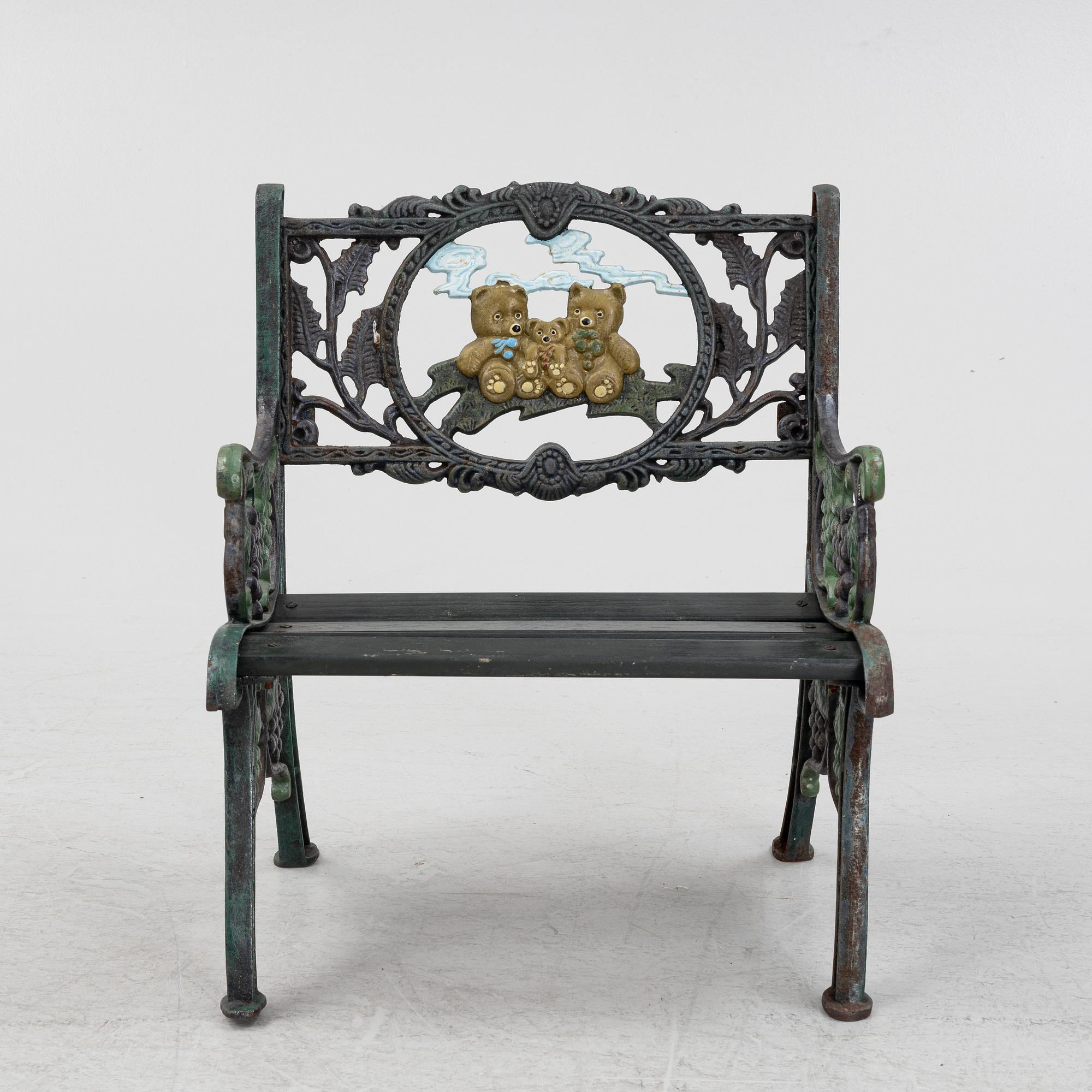 A children's cast iron garden sofa and armchair, mid 20th century.