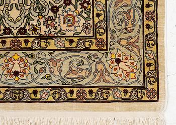 A silk Hereke rug, Turkey, approx. 82 x 58 cm.