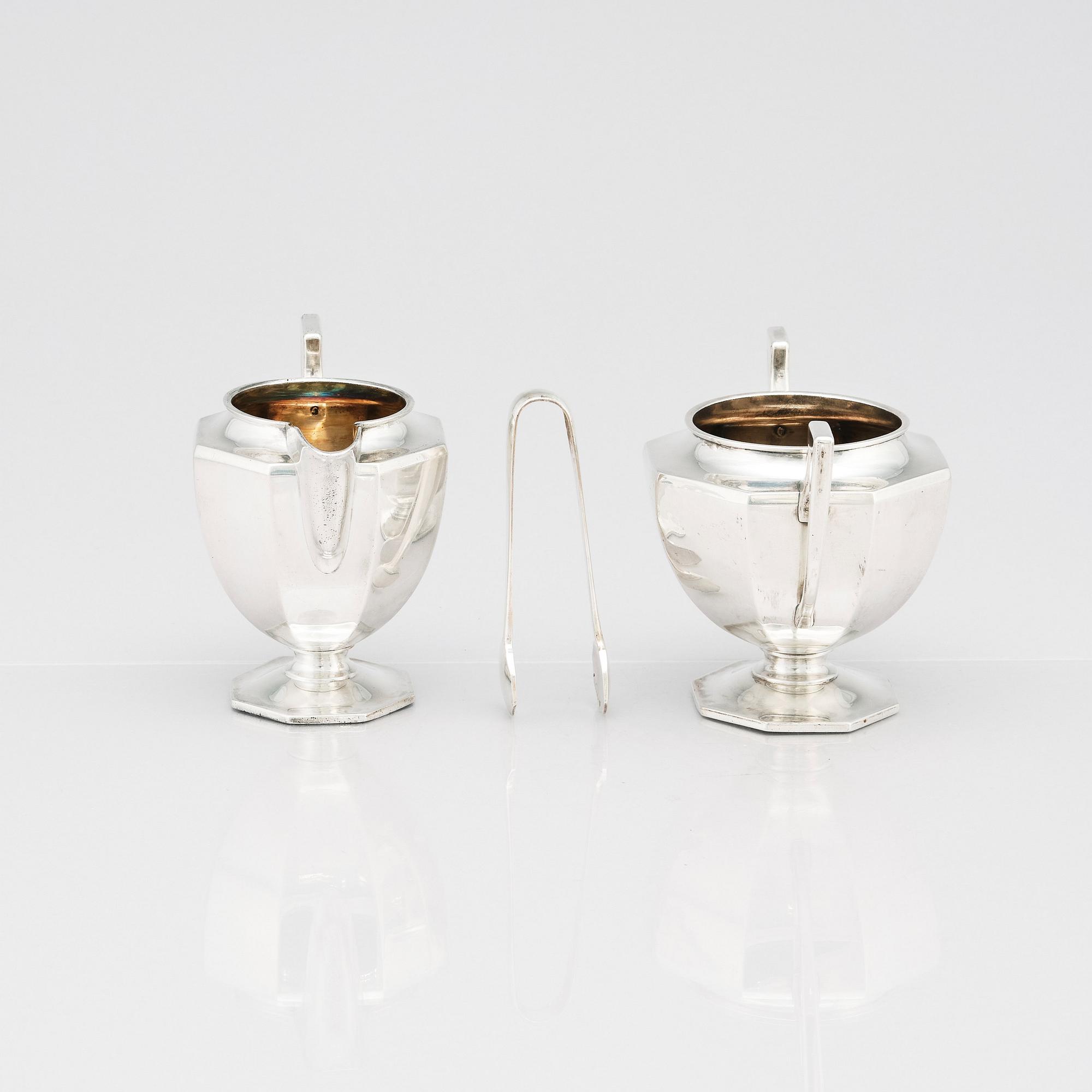 A box with a Japanese silver tea and coffee service by