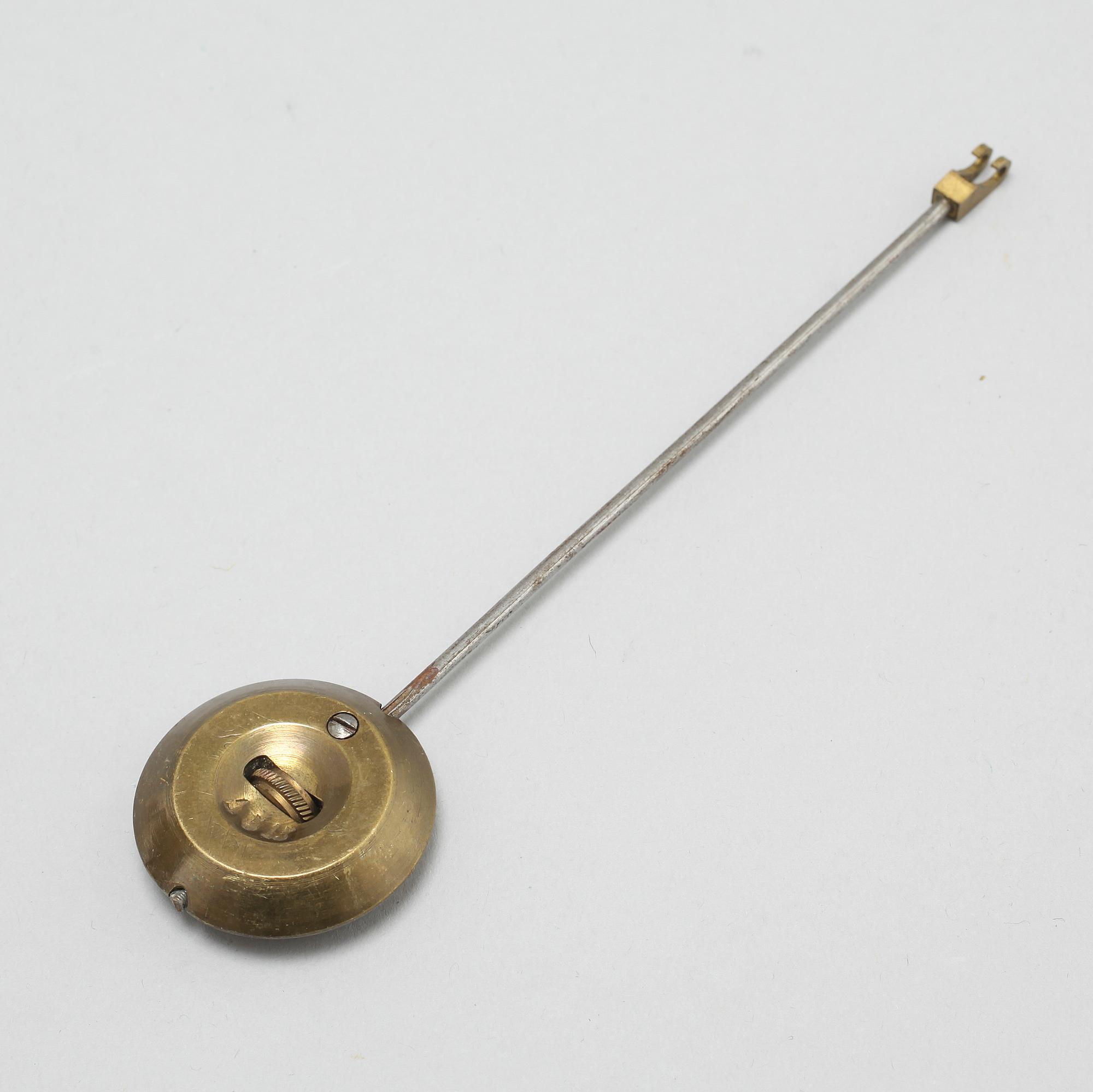 A table clock and two candelabras, around the year 1900.