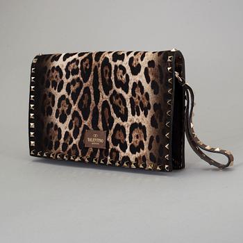 A ponyhair clutch with studs by Valentino.