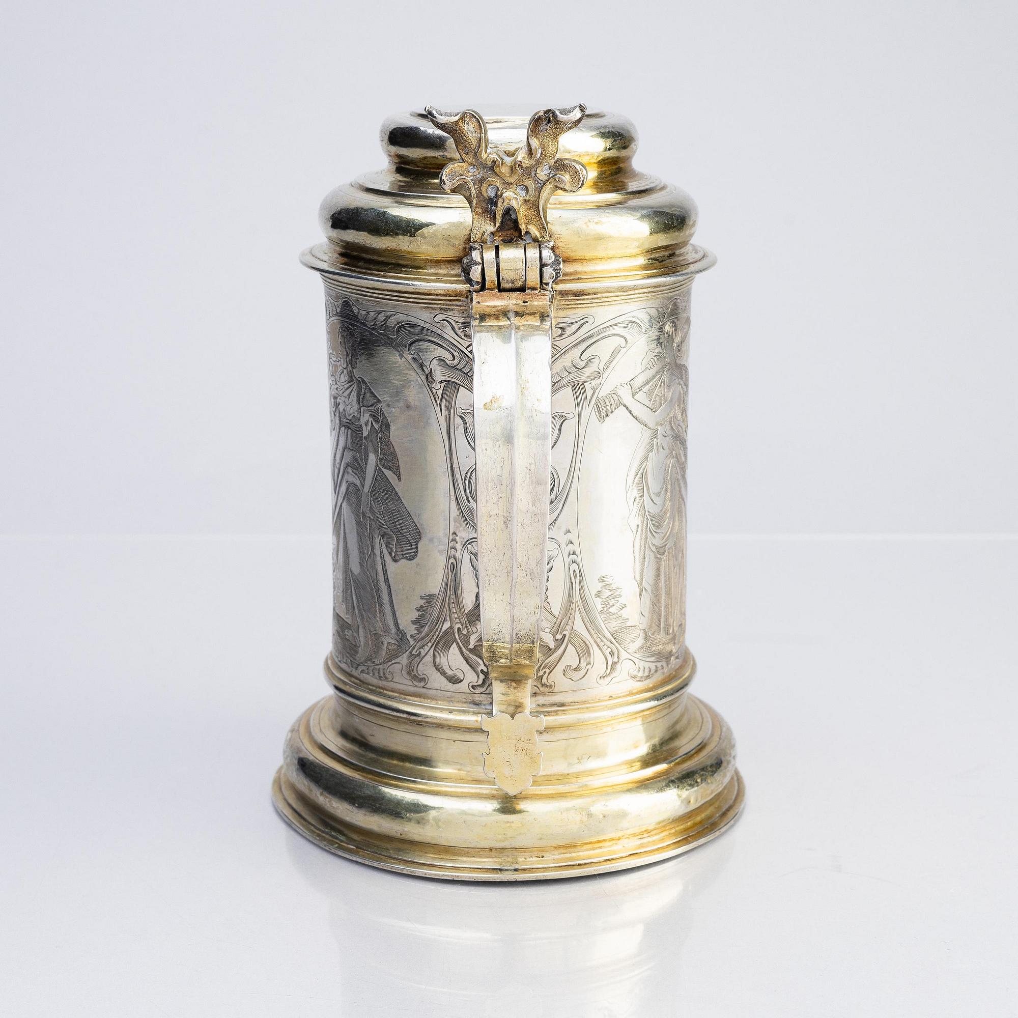 A German parcel-gilt silver tankard, mark of Walter Kopman, Hamburg (1649-1688).
