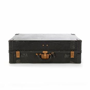 HERMÈS, a black leather suitcase from the 1950/60s.