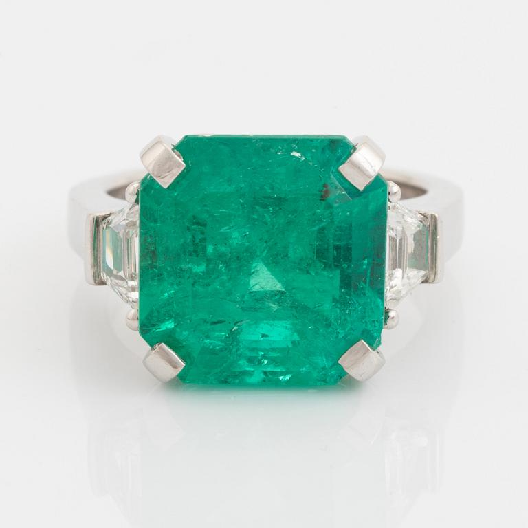 Emerald and trapezoid cut diamond ring.