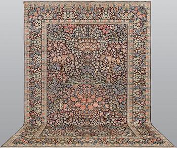 A 'Millefleur' Kerman Laver carpet, c. 410 x 290 cm.