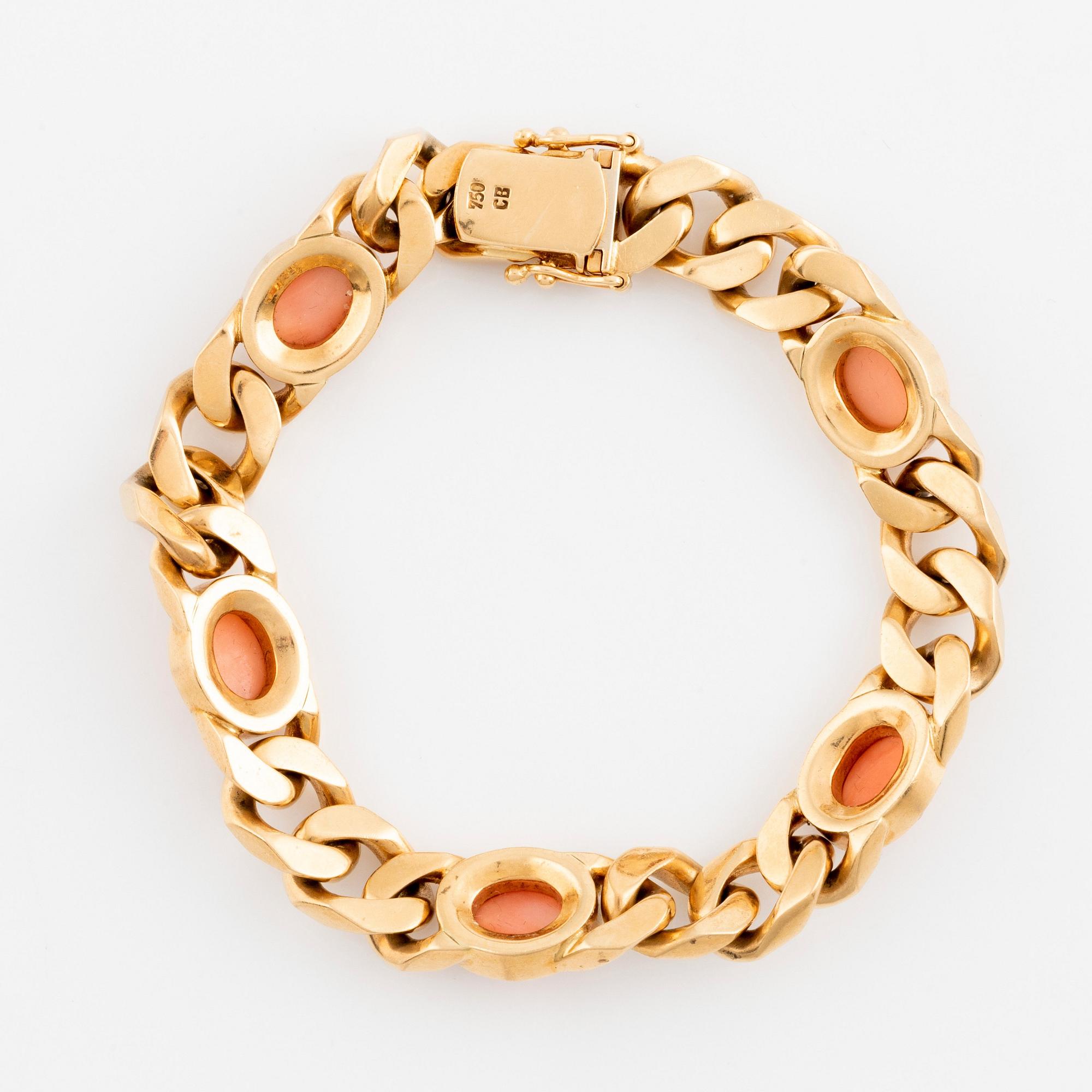 A Bucherer bracelet in 18K gold set with coral and round brilliant cut diamonds. Bukowskis