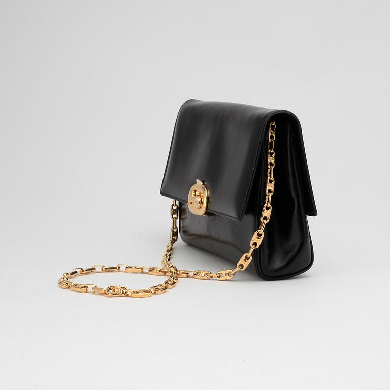 CÉLINE, a black leather evening bag.