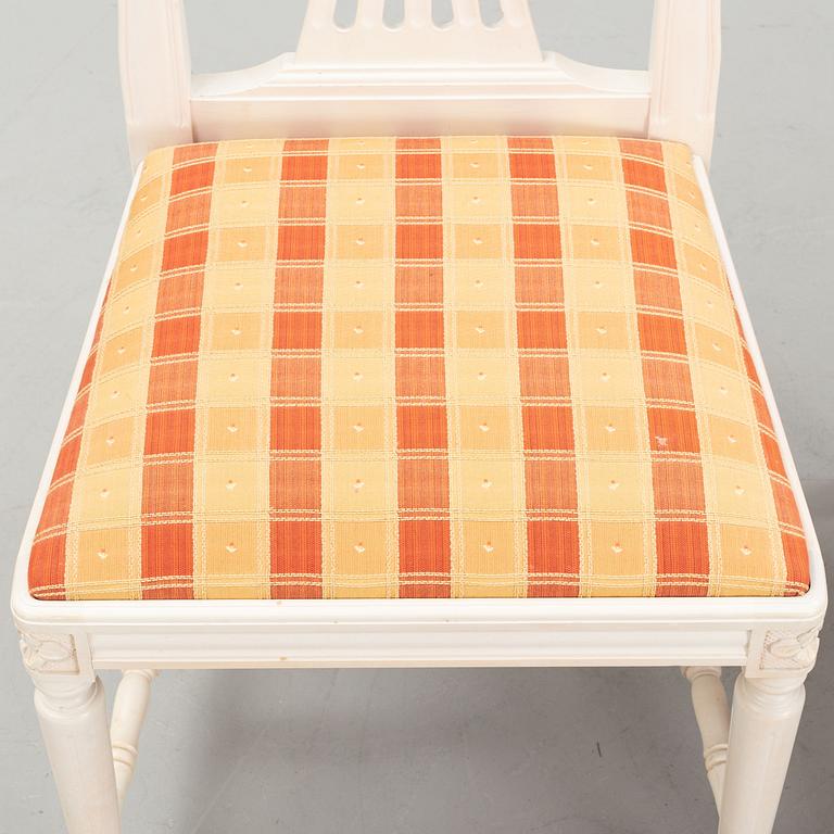 A dining table with eight chairs and a stool, Gustavian style, second half of the 20th Century.