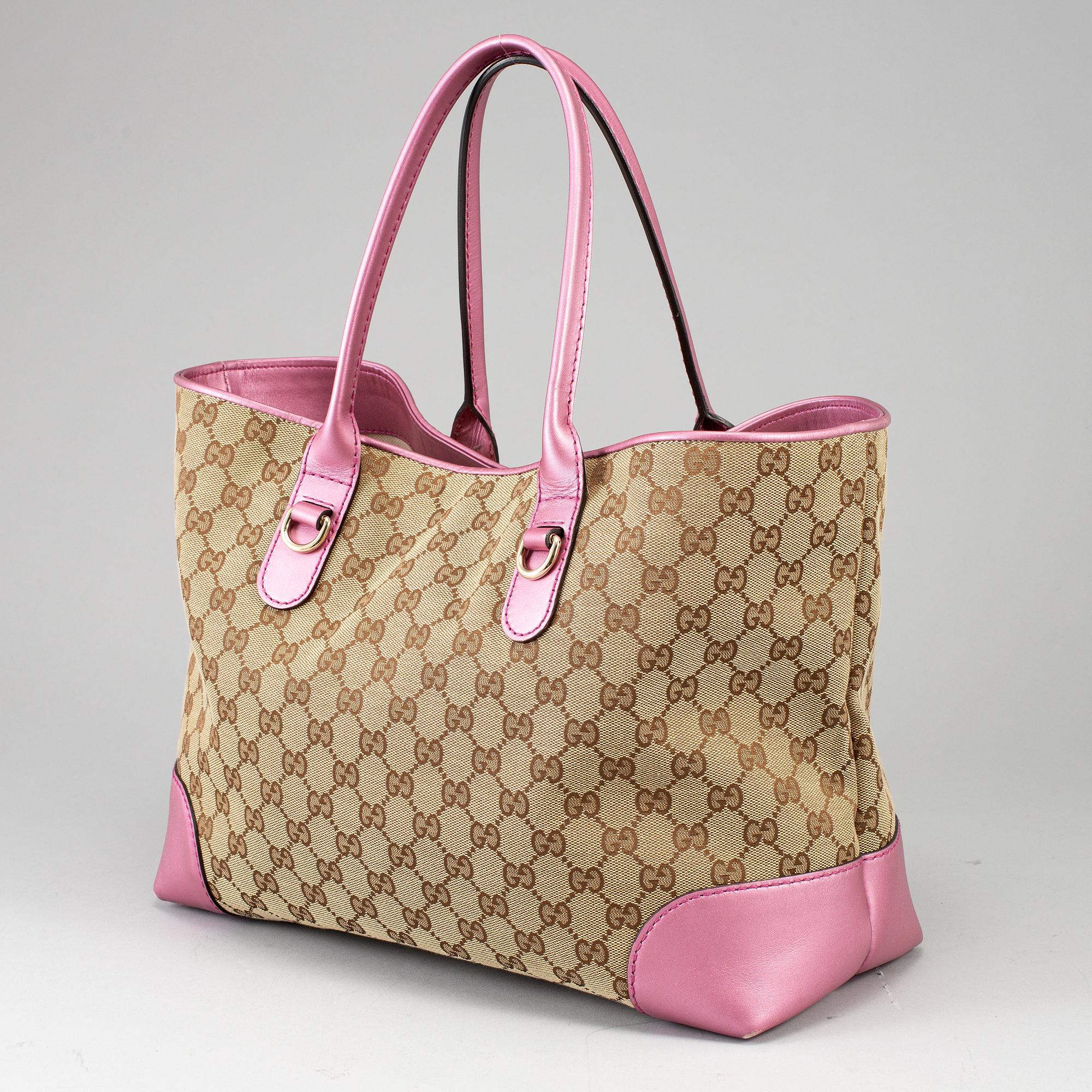 GUCCI, a monogram canvas and pink metallic leather handbag.