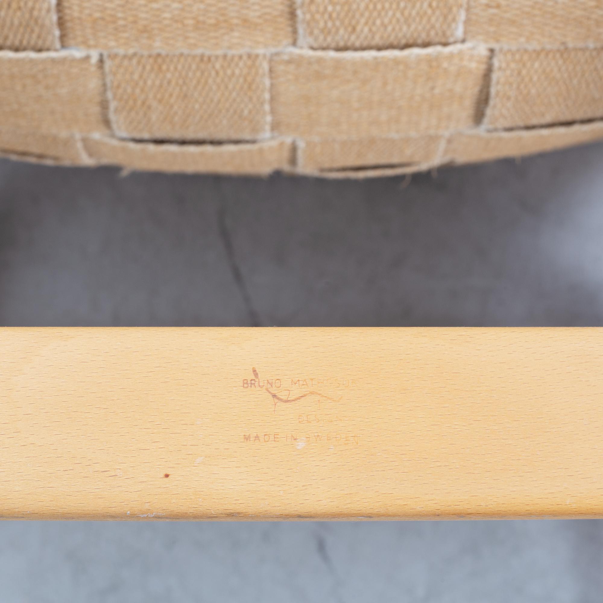 A pair of 'Eva' easy chairs by Bruno Mathsson for Firma Karl Mathsson, dated 1974.