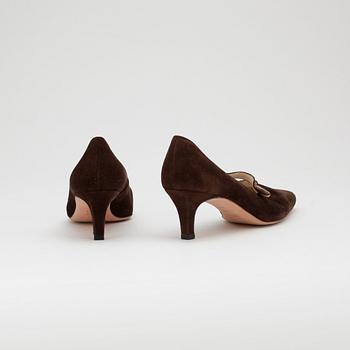 MANOLO BLAHNIK, a pair of brown suede pumps.