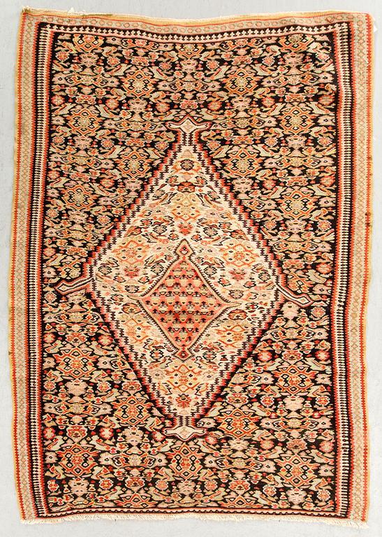 A semiantique Senneh carpet ca 159 x 106 cm.