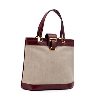 HERMÈS, a canvas and leather handbag.