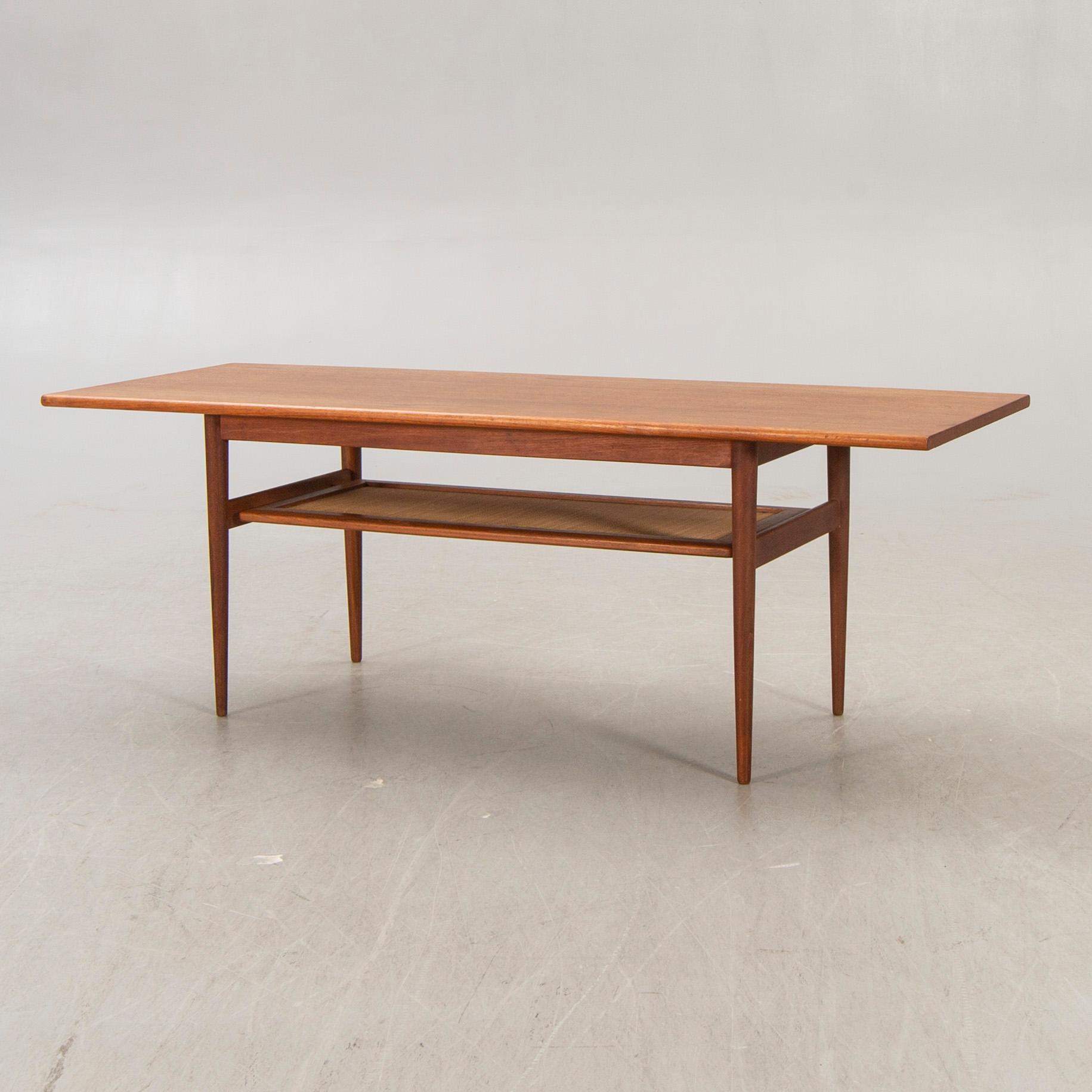 A Dansih 1960s teak and rattan  coffee table.