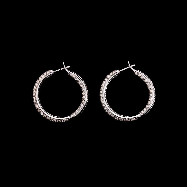 A pair of brilliant cut diamond earrings, tot. 4.08 cts.