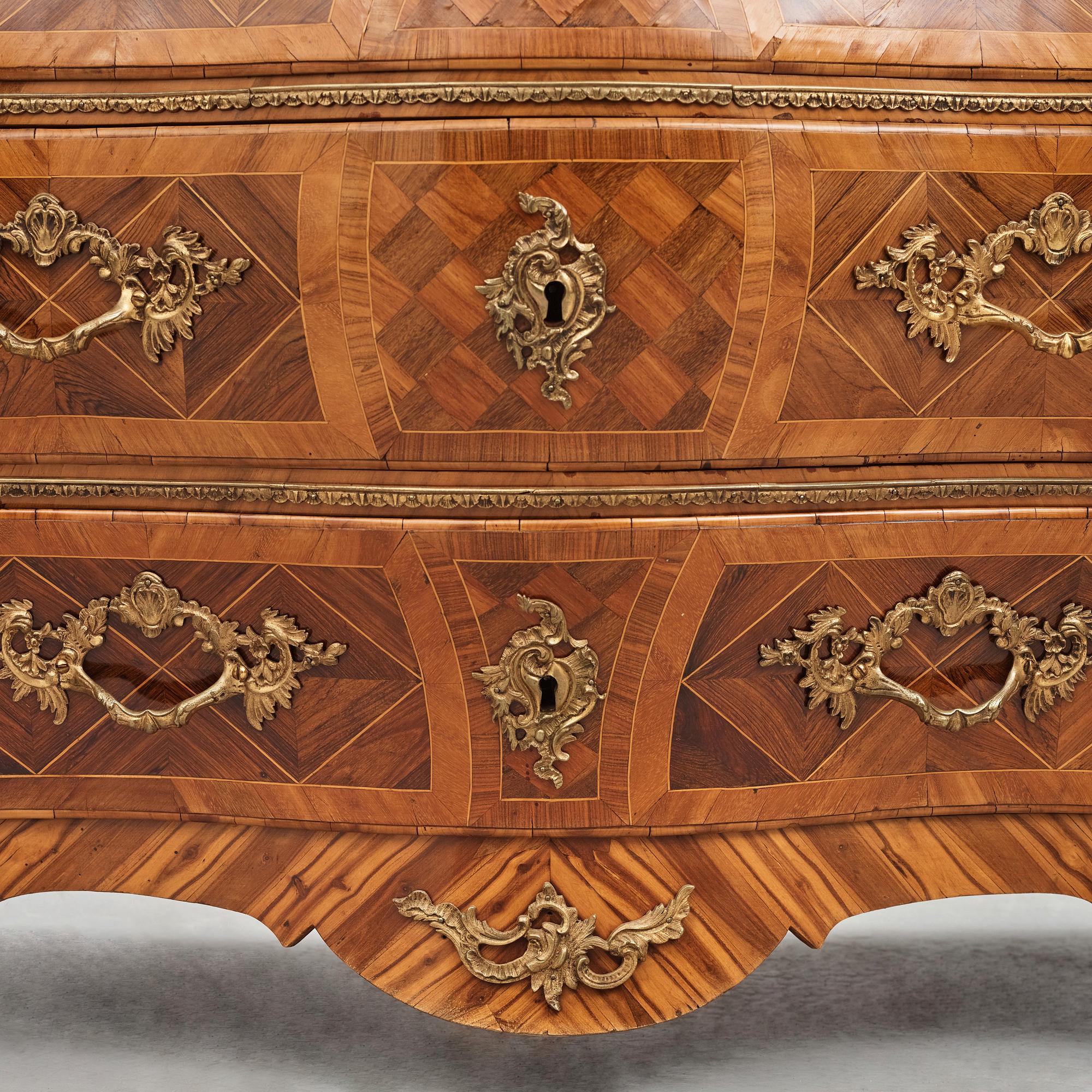 A rosewood-veneered and ormolu-mounted Rococo chest of drawers by J. Wahlbeck (master 1760-1782).