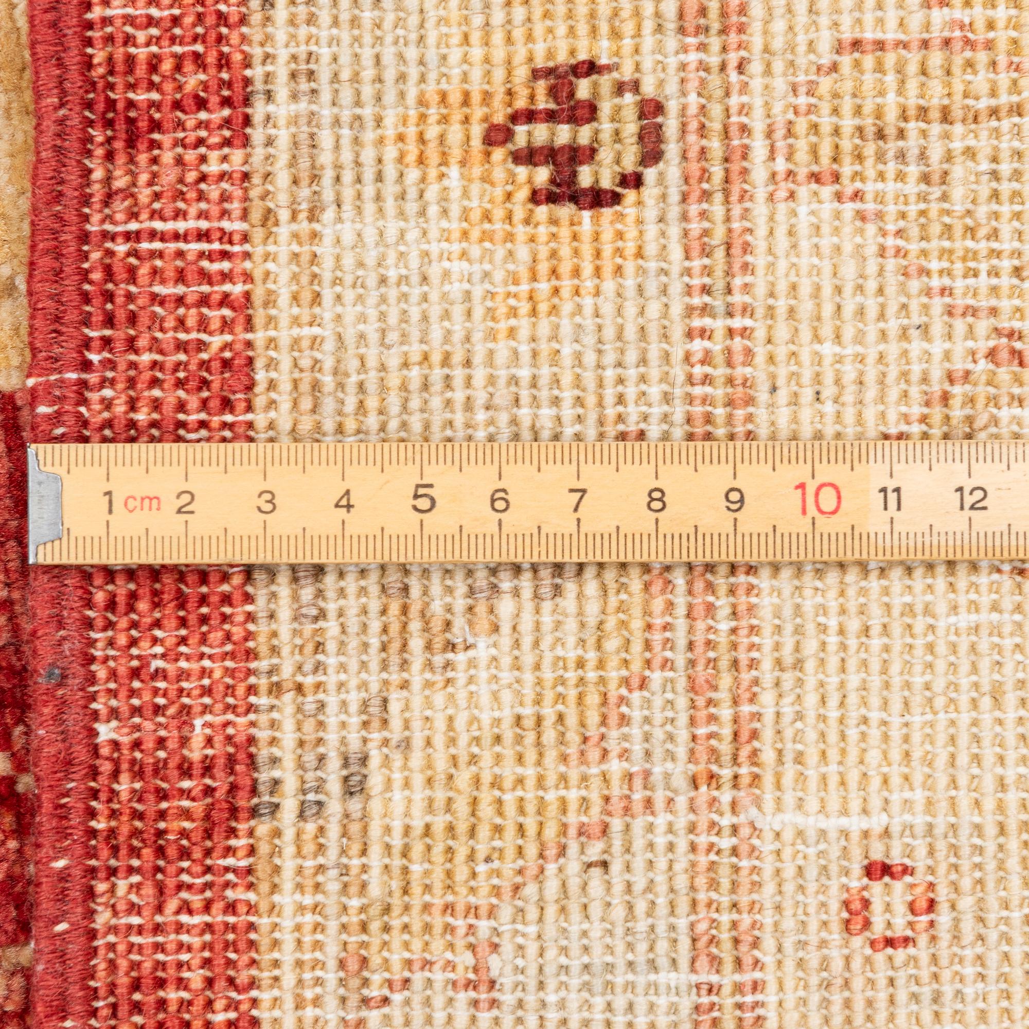 An Ushak carpet, c. 238 x 170 cm.