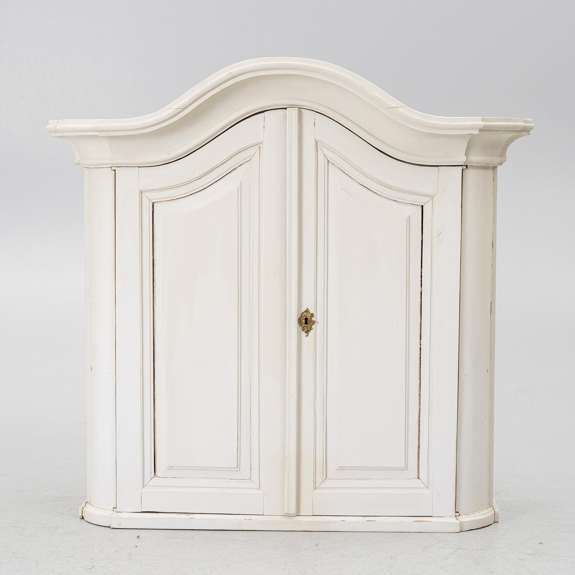 A Swedish rococo hanging cabinet, mid 18th century.