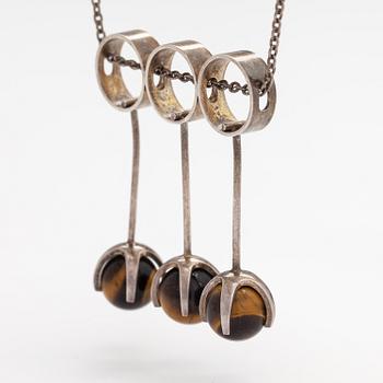 Elis Kauppi, A silver necklace with tiger's eye pearls. Kupittaan kulta, Turku 1965.