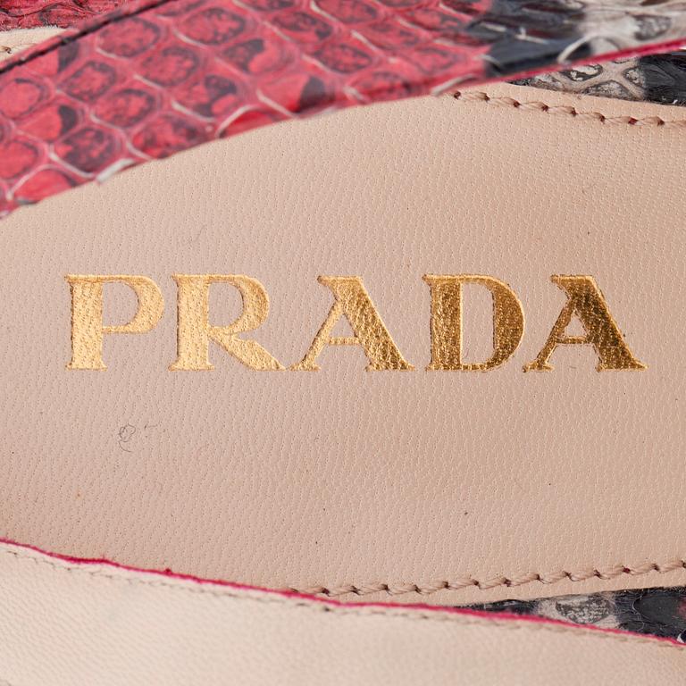 PRADA, a pair of embossed red leather sandals.