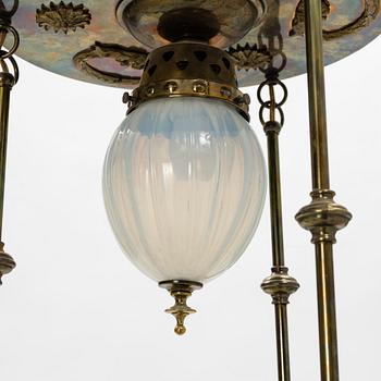 An Art Nouveau brass and glass table light, early 20th Century.