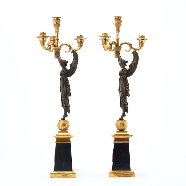 A pair of French Empire early 19th century four-light candelabra.