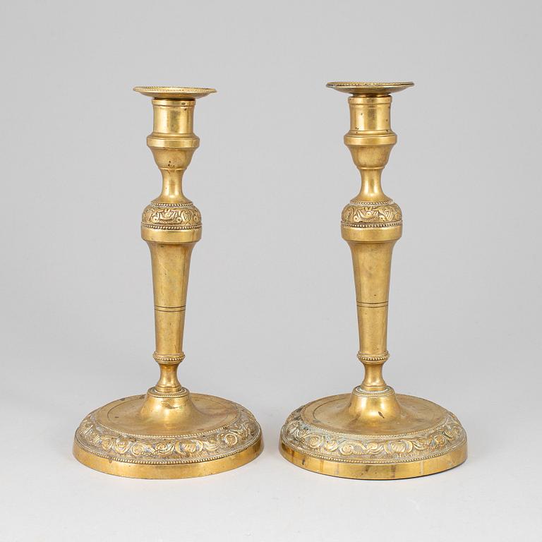 A pair of bronze candlesticks, first half of the 19th century.